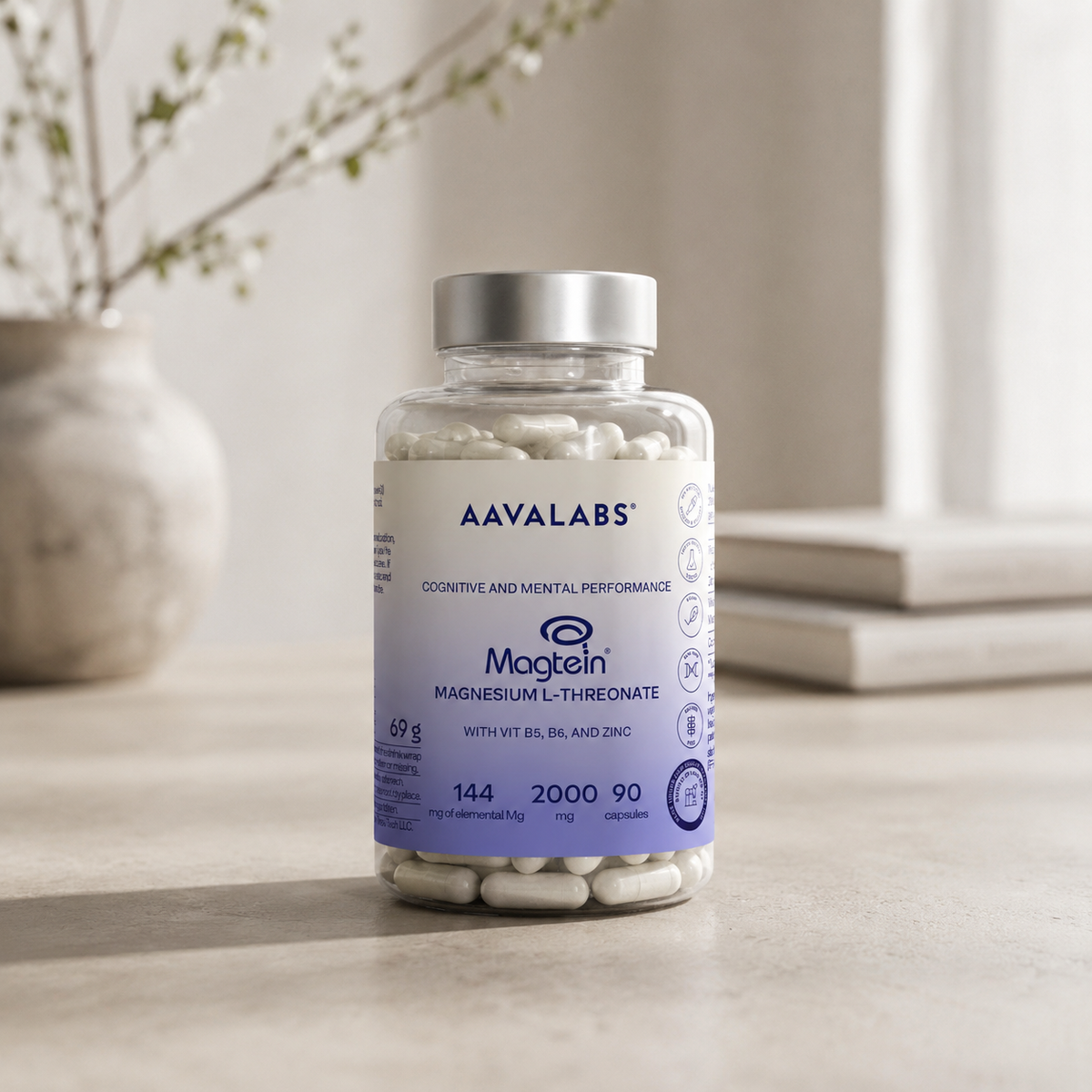 Bottle of Aavalabs Magtein supplement on a neutral surface with a blurred background