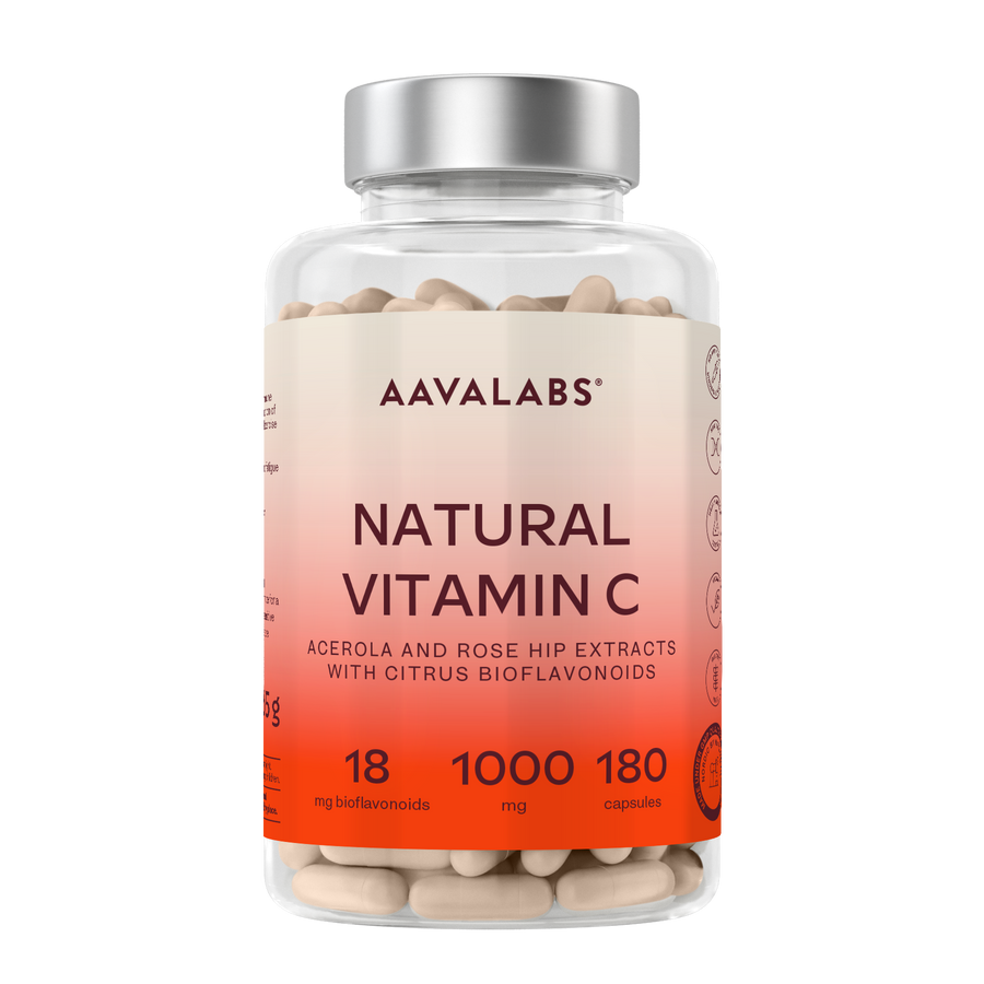 A clear plastic bottle of AAVALABS Natural Vitamin C capsules with a silver cap and a peach-to-orange gradient label, shown on a plain white background.